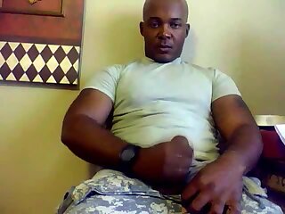 Beefy black soldier jerks off & cums